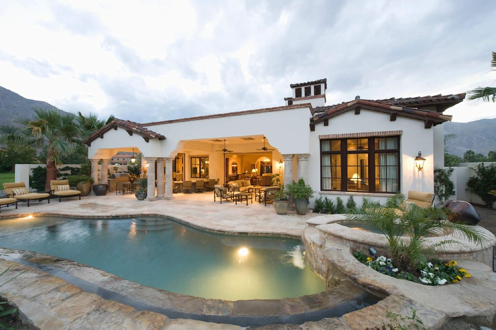 A pool that is in the middle of some kind of yard.