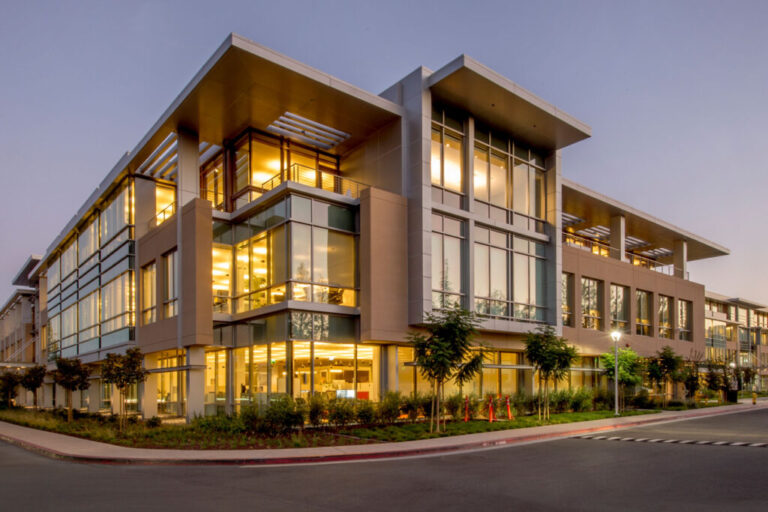 A building with many windows and lights on it